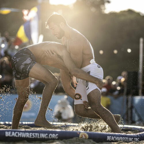 Ramiz Hasanov (L) of Azerbaijan competes against Levan Kelekhsashvili of Georgia during the final day of the fifth and final stop of the UWW Beach Wrestling World Series at Constanta, Romania on September 04, 2022.